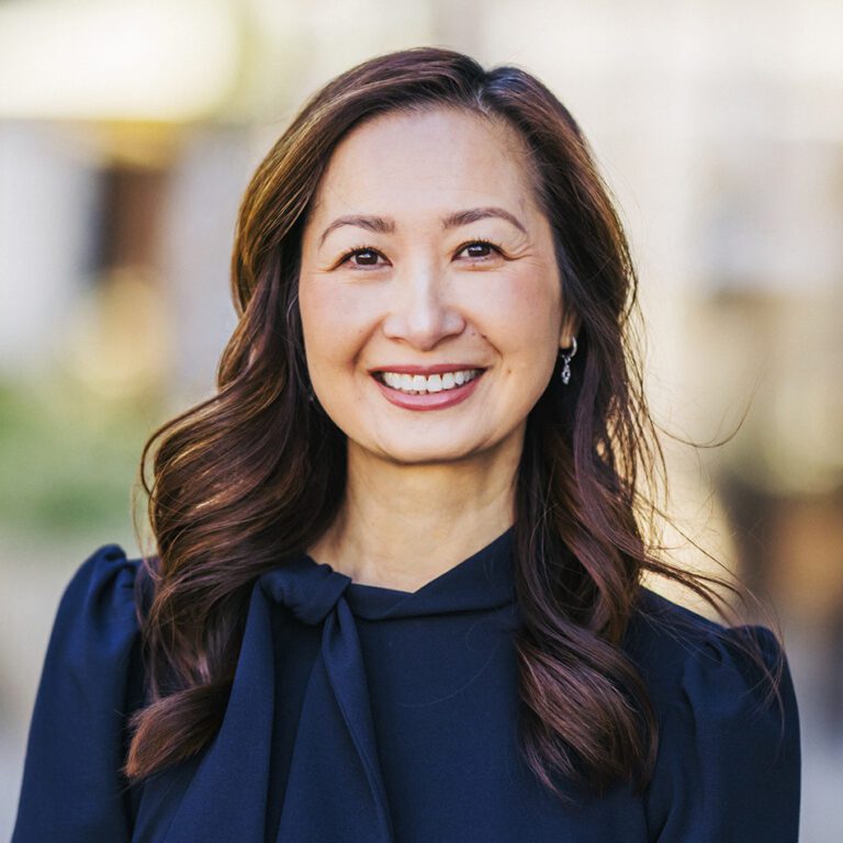 Woman in a black shirt with a bow