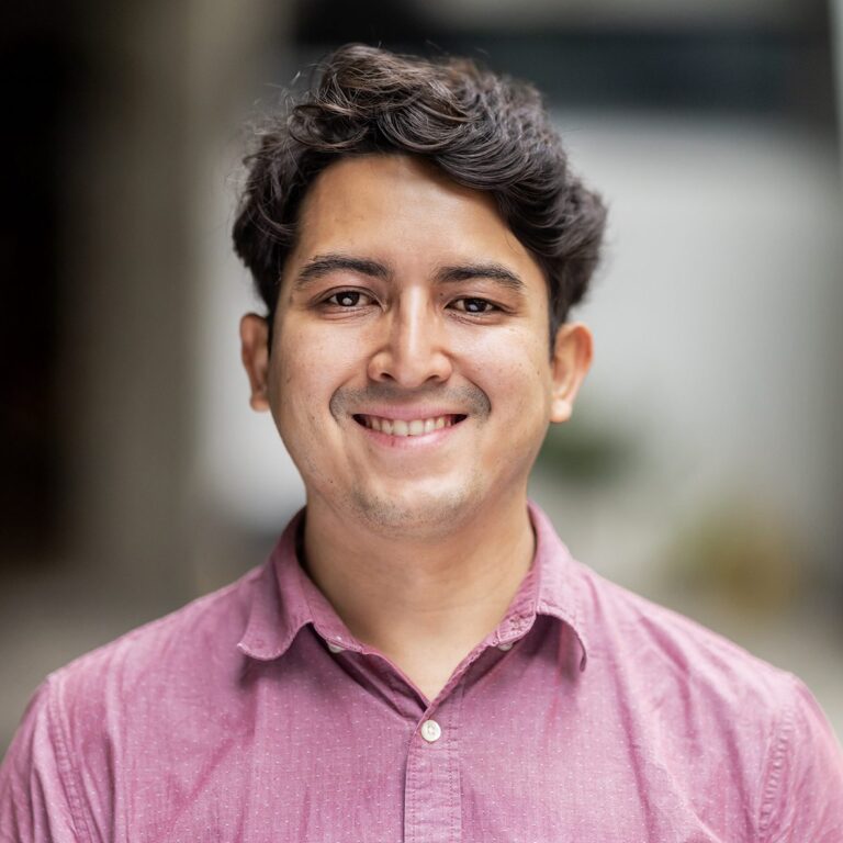 Man in a light red shirt